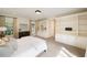 This bedroom features built-in shelving, natural light, and neutral tones throughout at 2374 Havenridge Nw Dr, Atlanta, GA 30305