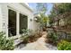 Charming stone patio with access to the home through french doors and landscaped path leading to yard at 2374 Havenridge Nw Dr, Atlanta, GA 30305