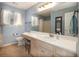 Bright bathroom with a single sink vanity, honey-comb print curtains, and tile flooring at 4260 Laurel Glen Ct, Douglasville, GA 30135