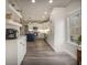 Spacious kitchen with white cabinets, a blue kitchen island, and stainless steel appliances at 4260 Laurel Glen Ct, Douglasville, GA 30135