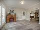 Sitting room showcasing built-in desk, French doors and entry into kitchen and living areas at 4260 Laurel Glen Ct, Douglasville, GA 30135