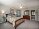 Comfortable main bedroom with carpet and a dresser at 4260 Laurel Glen Ct, Douglasville, GA 30135