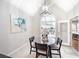 Bright breakfast nook with a modern chandelier and access to the backyard at 4910 Hunters Oaks Ln, Alpharetta, GA 30009