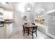 Charming breakfast nook featuring a large window and modern lighting at 4910 Hunters Oaks Ln, Alpharetta, GA 30009