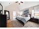 A serene main bedroom features plush carpet, natural light, and ensuite access at 4910 Hunters Oaks Ln, Alpharetta, GA 30009