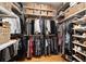 Well-organized walk-in closet with ample storage for clothing and shoes at 4910 Hunters Oaks Ln, Alpharetta, GA 30009