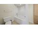 Bright bathroom featuring a soaking tub, white tile, and wood cabinets at 3777 Peachtree Ne Rd # 1007, Atlanta, GA 30319