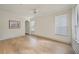Bright bedroom featuring wood floors, a ceiling fan, and windows with wood trim at 3777 Peachtree Ne Rd # 1007, Atlanta, GA 30319
