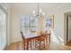Charming dining room boasts natural light, a stylish chandelier, and beautiful wood floors at 3777 Peachtree Ne Rd # 1007, Atlanta, GA 30319