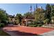 Elegant community entrance with a guardhouse, fountain, and mature trees at 3777 Peachtree Ne Rd # 1007, Atlanta, GA 30319