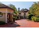 Exterior shot of the community entrance with lush landscaping and pavers at 3777 Peachtree Ne Rd # 1007, Atlanta, GA 30319