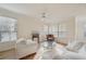 Inviting living room with wood floors, ceiling fan, and natural light from multiple windows at 3777 Peachtree Ne Rd # 1007, Atlanta, GA 30319