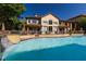 Community pool featuring a waterfall, seating and beautifully landscaped building at 3777 Peachtree Ne Rd # 1007, Atlanta, GA 30319
