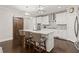 Bright kitchen features a marble countertop island, hardwood floors, and a sliding barn door at 435 Webb Dr, Norcross, GA 30071