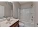 Bathroom features a white tub and shower combination, with a modern vanity and bright lighting at 4498 Dunblane Ave, Sugar Hill, GA 30518