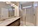 Bathroom with double sink vanity and shower stall at 4498 Dunblane Ave, Sugar Hill, GA 30518