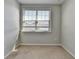 Bright bedroom with carpet, a window and neutral walls, creating a serene and inviting space to relax and unwind at 4498 Dunblane Ave, Sugar Hill, GA 30518