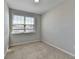 Bright bedroom with carpet, a window and neutral walls, creating a serene and inviting space to relax and unwind at 4498 Dunblane Ave, Sugar Hill, GA 30518