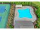 Aerial view of community pool with tennis court and lounge chairs at 4498 Dunblane Ave, Sugar Hill, GA 30518