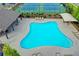 Aerial view of community pool with lounge chairs and covered seating area at 4498 Dunblane Ave, Sugar Hill, GA 30518