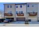 Townhomes offer drive-in garages, private decks and uniform construction, providing a cohesive community aesthetic at 4498 Dunblane Ave, Sugar Hill, GA 30518