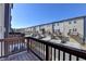 Townhome exterior with wood deck showcases multiple units with individual garages and ample parking at 4498 Dunblane Ave, Sugar Hill, GA 30518