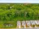 Stunning aerial view showcases the property's prime location with serene pond and lush green surroundings at 628 Avondale Hills Dr, Decatur, GA 30032