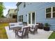 Backyard patio with stylish outdoor furniture and lush landscaping, perfect for relaxing at 628 Avondale Hills Dr, Decatur, GA 30032