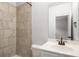 Bathroom showcases tile shower, vanity, mirror and faucet at 628 Avondale Hills Dr, Decatur, GA 30032