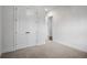 Clean and simple bedroom featuring neutral carpet and double doors, offering a serene space at 628 Avondale Hills Dr, Decatur, GA 30032