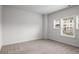 A bright bedroom featuring large windows, neutral walls, and carpet, providing a serene and inviting atmosphere at 628 Avondale Hills Dr, Decatur, GA 30032