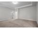 A spacious bedroom showcasing neutral walls and plush carpeting, enhanced by natural light streaming through a large window at 628 Avondale Hills Dr, Decatur, GA 30032