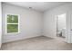 Bedroom view with bathroom entrance featuring tile flooring, toilet, and vanity at 628 Avondale Hills Dr, Decatur, GA 30032