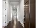 Bright hallway with hardwood floors, white walls, recessed lighting, and access to various rooms at 628 Avondale Hills Dr, Decatur, GA 30032