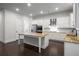 Spacious kitchen featuring white cabinets, granite countertops, and stainless steel appliances at 628 Avondale Hills Dr, Decatur, GA 30032