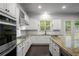 Well-equipped kitchen featuring granite counters, stainless appliances and natural light at 628 Avondale Hills Dr, Decatur, GA 30032