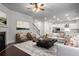 Bright, open living room with fireplace, hardwood floors, and modern decor that connects to the kitchen at 628 Avondale Hills Dr, Decatur, GA 30032