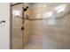 A tiled shower features a built-in seat, multiple shower heads, and a glass enclosure, offering a spa-like experience at 628 Avondale Hills Dr, Decatur, GA 30032