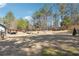Wide shot of the backyard with a patio and firepit at 1369 Sierra Ridge Pl, Loganville, GA 30052