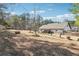 Large, flat backyard with established trees at 1369 Sierra Ridge Pl, Loganville, GA 30052