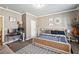 Bedroom featuring a full bed, a workstation area, carpet flooring, crown molding and natural light at 1369 Sierra Ridge Pl, Loganville, GA 30052