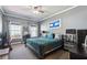 Comfortable bedroom with carpet, windows, ceiling fan and closet at 1369 Sierra Ridge Pl, Loganville, GA 30052