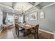 Elegant dining room with coffered ceiling and chandelier at 1369 Sierra Ridge Pl, Loganville, GA 30052