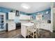 Well-lit kitchen with modern appliances, ample counter space, and a cozy island at 1369 Sierra Ridge Pl, Loganville, GA 30052