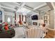 Inviting living room with coffered ceilings, fireplace, and lots of natural light at 1369 Sierra Ridge Pl, Loganville, GA 30052