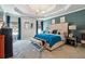 Serene main bedroom with tray ceilings, elegant furnishings, and calming decor at 1369 Sierra Ridge Pl, Loganville, GA 30052