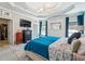 A bright main bedroom shows a decorative ceiling, a large window, and an open door to a walk-in closet at 1369 Sierra Ridge Pl, Loganville, GA 30052