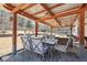 Outdoor patio with furniture and ceiling fan overlooking backyard at 1369 Sierra Ridge Pl, Loganville, GA 30052