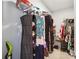 Organized walk-in closet with shelving, hanging racks, and ample storage space for clothes and accessories at 1369 Sierra Ridge Pl, Loganville, GA 30052