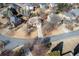 Aerial view of a home in a residential neighborhood with mature trees and well-maintained lawns at 2520 Cross Springs Dr, Cumming, GA 30041